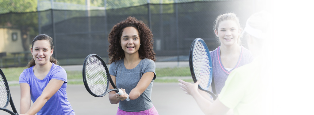 Physically challenged teenage girl (amputee) playing tennis